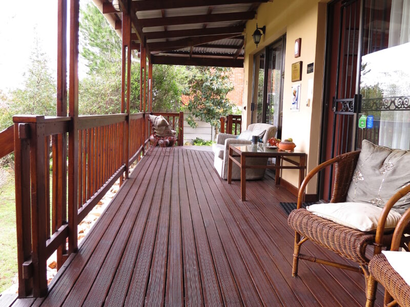 view from just outside family room no.1. no steps to access room 1. family room no. 2 is at other end of wooden deck.